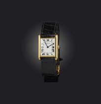 Cartier, a gold 'Tank Louis Cartier' wristwatch, 1980s, rectangular white enamel dial with black