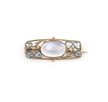 An Arts and Crafts moonstone and enamel brooch, early 20th century, set with a cabochon moonstone,