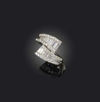 No reserve - a diamond ring, of crossover design, set with brilliant-cut and baguette diamonds