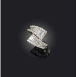 No reserve - a diamond ring, of crossover design, set with brilliant-cut and baguette diamonds