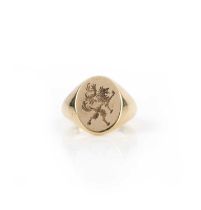 A gold signet ring, the oval front engraved with a lion rampant, in 18ct gold, size S1/2, British