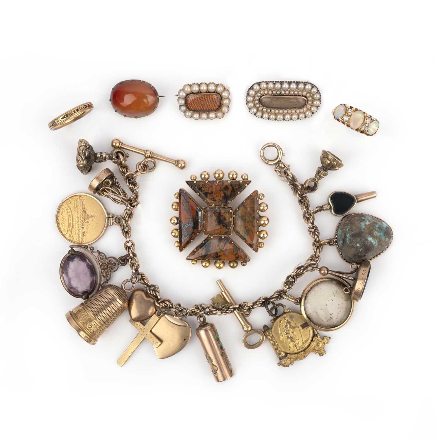 A collection of jewels including a charm bracelet, 19th/early 20th century, comprising: a jasper and