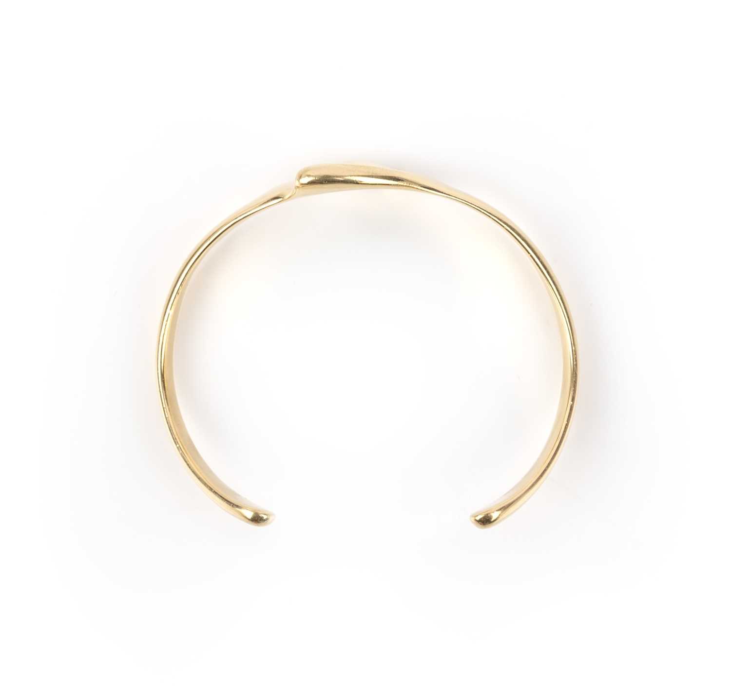 Elsa Peretti for Tiffany & Co, a gold bangle, designed as a stylised heart in polished yellow - Image 2 of 2