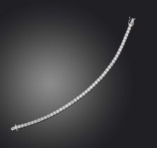 A diamond line bracelet, designed as an articulated line of brilliant-cut diamonds totalling