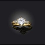 A diamond ring, claw-set with a circular-cut diamond weighing approximately 1.20 carats, to