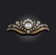 A pearl and diamond brooch, late 19th century, centring on a pearl measuring approximately 8.0 x 8.8