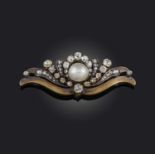 A pearl and diamond brooch, late 19th century, centring on a pearl measuring approximately 8.0 x 8.8