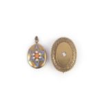 A Victorian gold locket pendant, of oval form set with a central coral cabochon within seed pearl