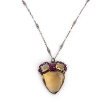 Attributed to Dorrie Nossiter, a citrine and synthetic ruby pendant, early 20th century, set with