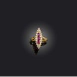 A ruby and diamond navette-shaped ring, set with graduated rubies within a diamond border in