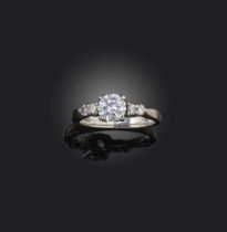 A diamond ring, set with a brilliant-cut diamond weighing approximately 0.60 carats, to shoulders
