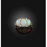 An opal and diamond ring, late 19th century, the oval opals mounted in a carved and pierced yellow