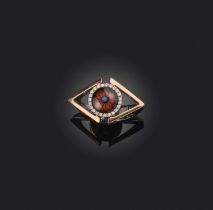 A diamond-set gold eye ring, the eye set within a surround of diamonds in gold, size J