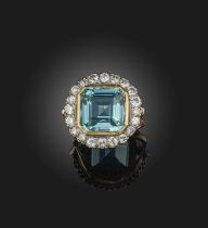 A blue tourmaline and diamond cluster ring, the square step-cut tourmaline set within a surround