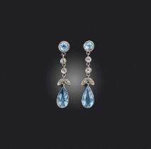 A pair of aquamarine and diamond earrings, early 20th century, each of pendent design, set with