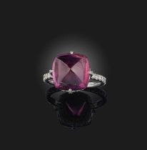 A spinel and diamond ring, set with a sugarloaf pink spinel weighing 10.71 carats, to a mount set