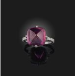 A spinel and diamond ring, set with a sugarloaf pink spinel weighing 10.71 carats, to a mount set