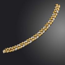 A diamond-set bi-colour gold bracelet, twelve of the plaited links set with graduated circular-cut