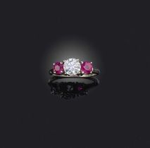 A ruby and diamond ring, claw-set with a brilliant-cut diamond weighing approximately 1.00 carat,