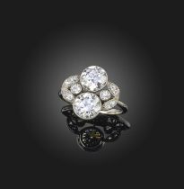 An Edwardian diamond cluster ring, with two principal diamonds weighing approximately 1.80 and 1.