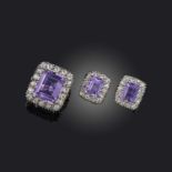 An amethyst and diamond demi-parure, comprising: a ring and a pair of earrings, each of