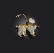 A late 19th century gold poodle brooch, the stylised dog with a pearl forming its face, with