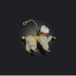 A late 19th century gold poodle brooch, the stylised dog with a pearl forming its face, with