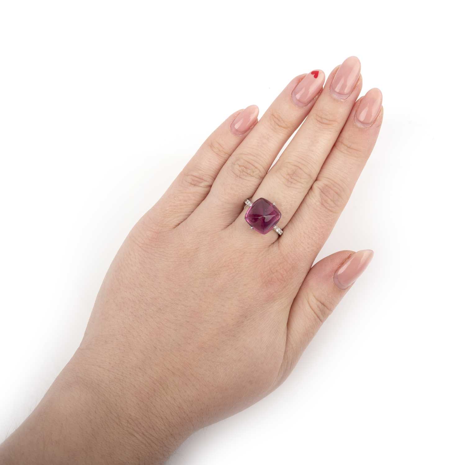 A spinel and diamond ring, set with a sugarloaf pink spinel weighing 10.71 carats, to a mount set - Image 3 of 4