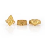 No reserve - a collection of three gold dress rings, India, each of ornate design with engraved