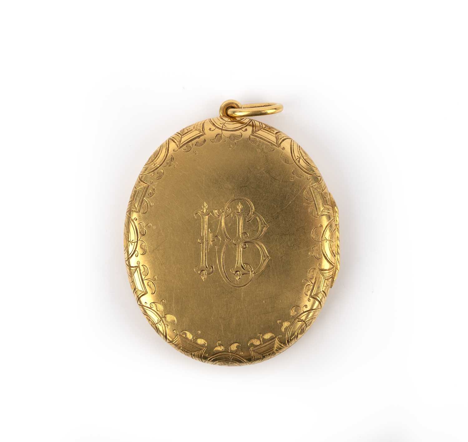 A large Victorian gold locket pendant, of oval form, engraved to the exterior with the Bell family - Image 2 of 2