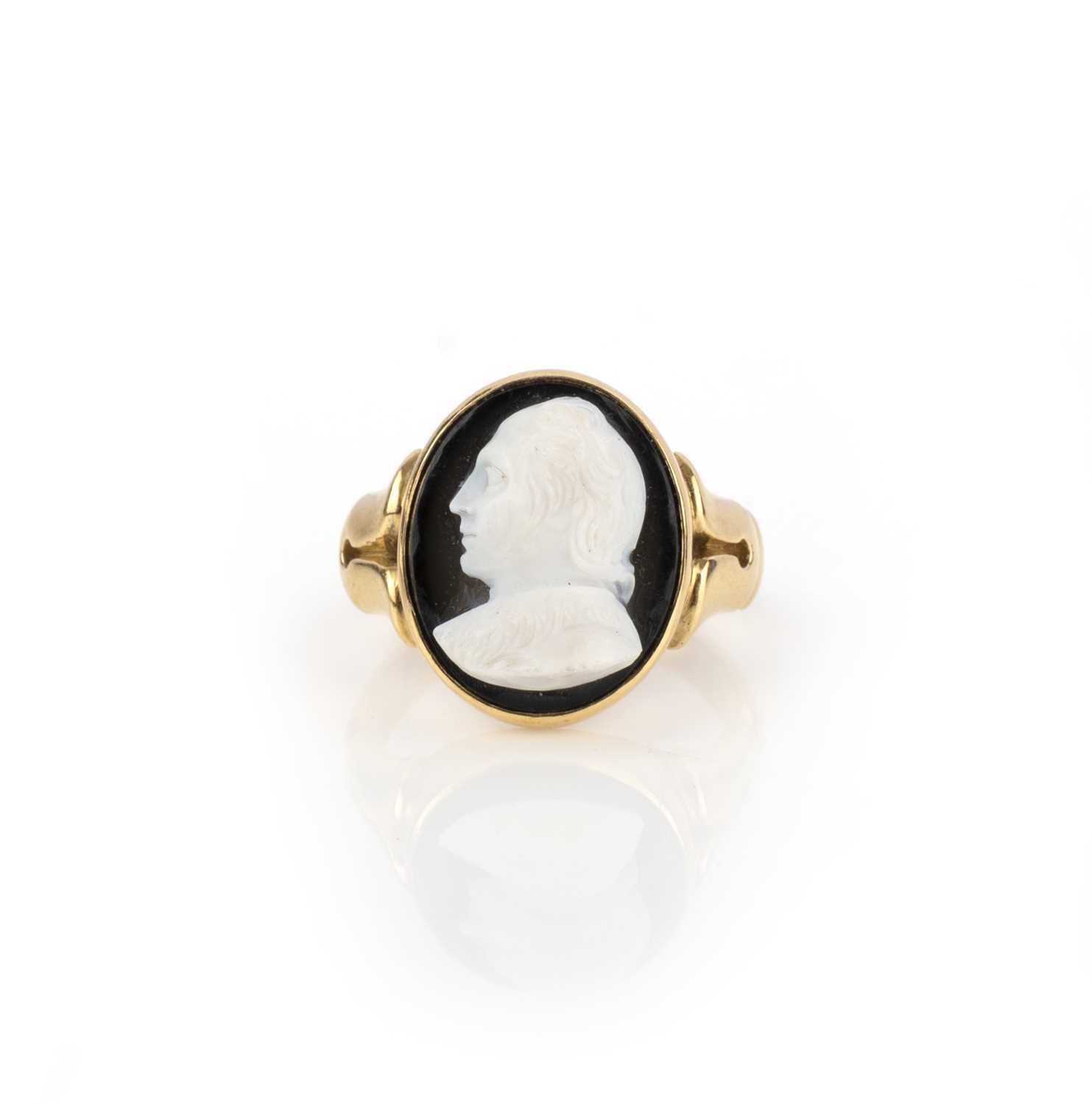 An onyx cameo ring, circa 1881, set with an oval onyx cameo depicting the philosopher John Locke (