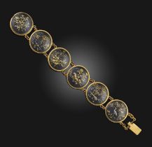 A gold and shakudō bracelet, late 19th century, of Japanese inspiration, composed of circular
