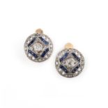 A pair of synthetic sapphire and diamond earrings, mid 20th century, each set with circular-cut