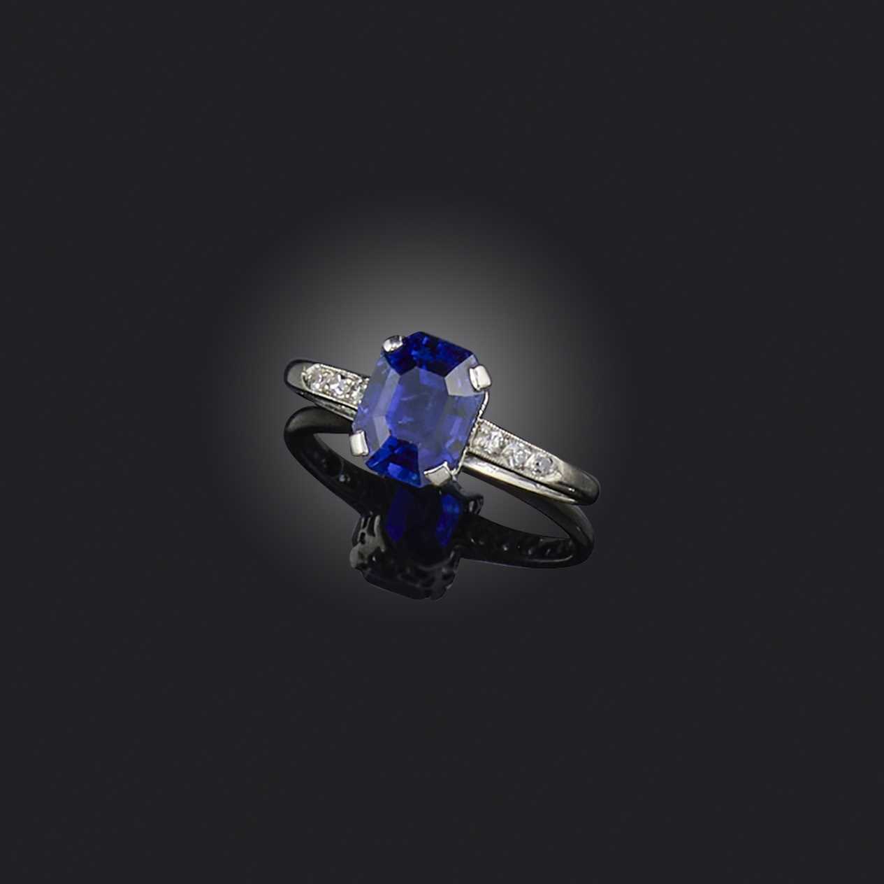 An Art Deco sapphire and diamond ring, 1920s, set with a step-cut sapphire weighing approximately