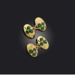 A pair of Edwardian gold cufflinks, each decorated with a green enamel shamrock set with a diamond
