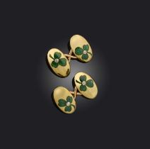 A pair of Edwardian gold cufflinks, each decorated with a green enamel shamrock set with a diamond