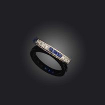 A sapphire and diamond eternity ring, 1930s, set with a continuous band of single-cut diamonds and