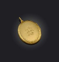 A large Victorian gold locket pendant, of oval form, engraved to the exterior with the Bell family