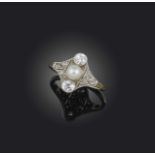 An Art Deco pearl and diamond ring, set with a pearl flanked with old circular-cut diamonds within