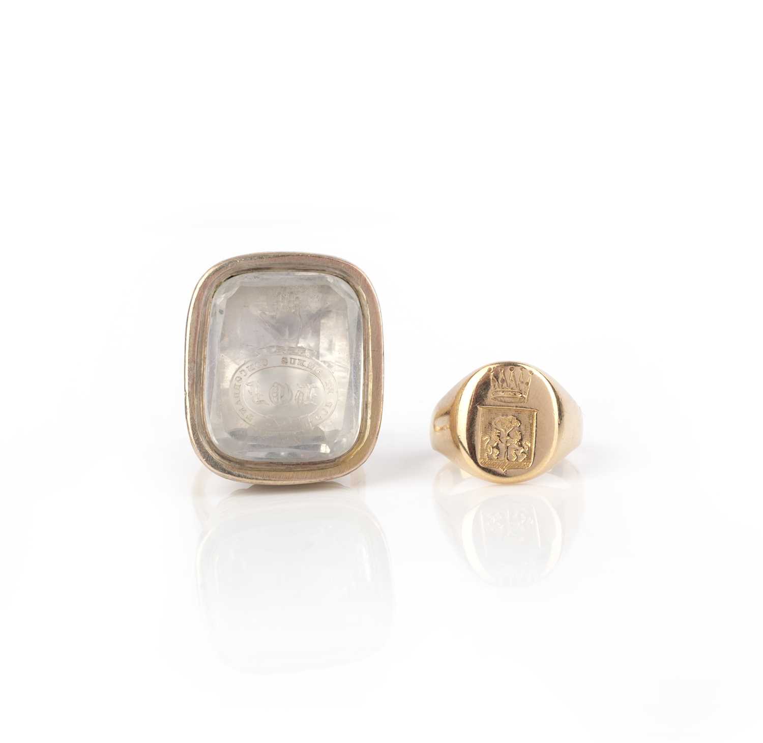 A signet ring and a rock crystal intaglio ring, late 19th century, comprising: a gold signet ring,