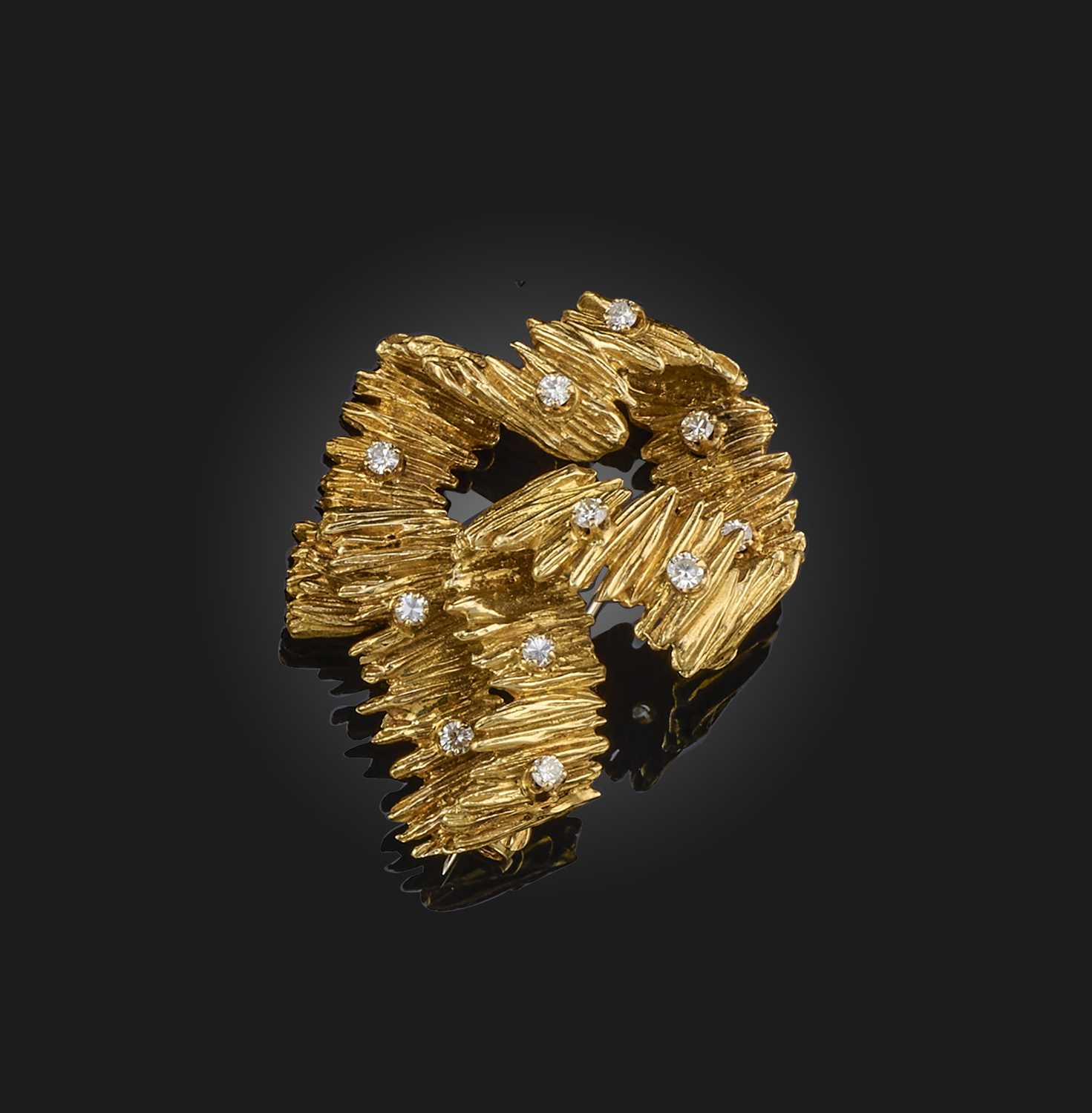 Ben Rosenfeld, a gold and diamond brooch, London, circa 1970, designed as a ribbon of textured