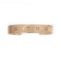 A 9ct gold open bangle, of plain polished design with London hallmarks for 2003, internal width 7cm