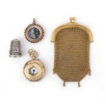 A group of jewels including a gold mesh purse, comprising: a mother of pearl compass pendant mounted