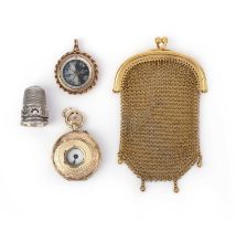 A group of jewels including a gold mesh purse, comprising: a mother of pearl compass pendant mounted