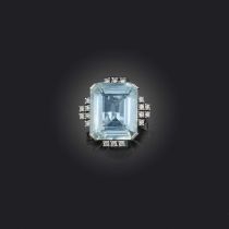 An aquamarine and diamond ring, claw-set with a step-cut aquamarine weighing approximately 17.00