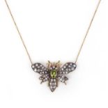 A peridot and diamond bee pendant, set with graduated diamonds and ruby eyes with an oval peridot