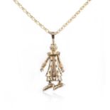 A gold and gem-set pendant necklace, designed as a clown, set with circular-cut gemstones and