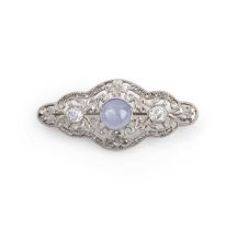 A star sapphire and diamond brooch, early 20th century, set with a cabochon star sapphire weighing