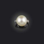 A natural pearl ring, first half 20th century, centring on a bouton-shaped natural pearl measuring