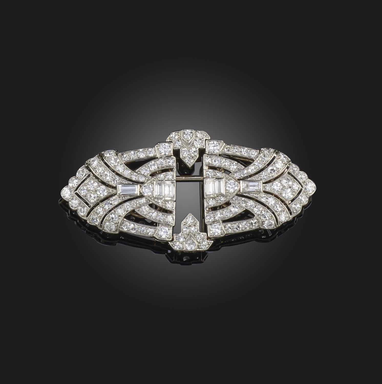 An Art Deco diamond double clip brooch, 1930s, of geometric design, set with single-cut, circular-